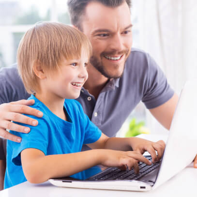 Father and son on a laptop