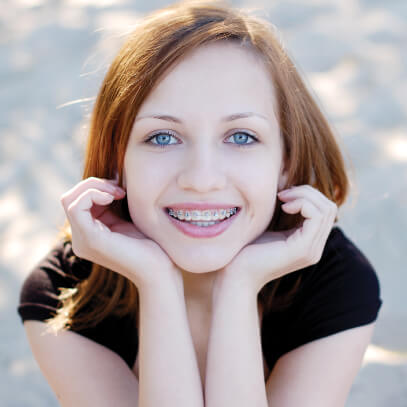 Red-headed girl smiling at camera