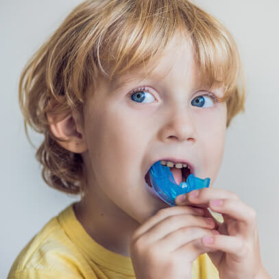 Boy testing out mouthguard