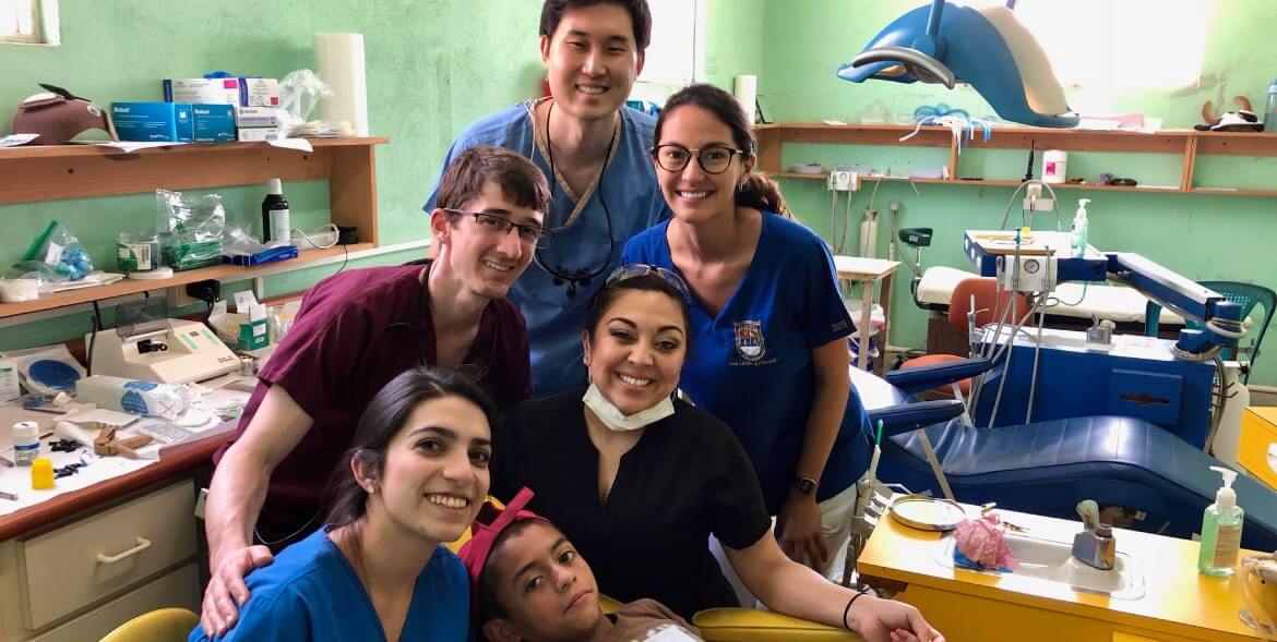 Dental team smiling with patient