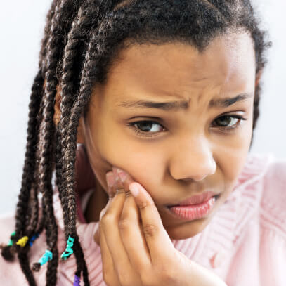 Girl with toothache pain