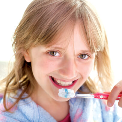 Girl brushing teeth