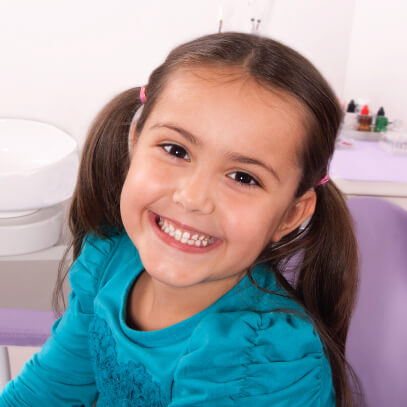 Girl smiling at the dentist