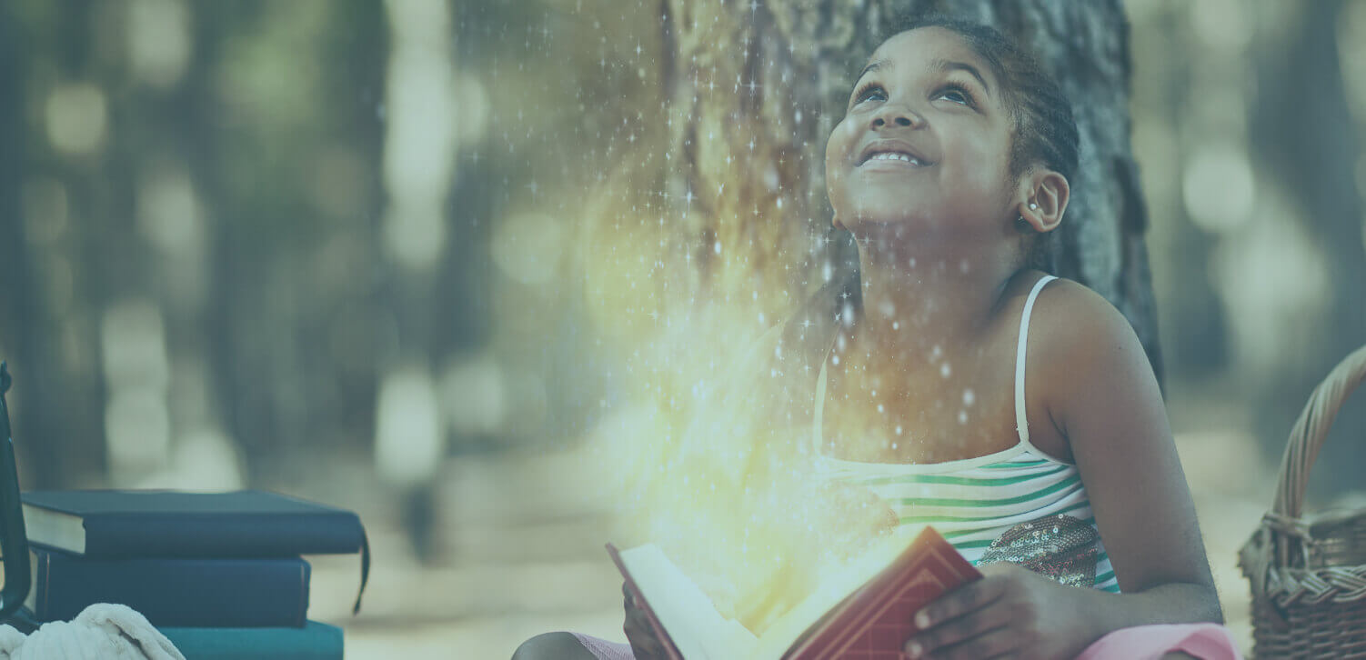 Girl reading magical book