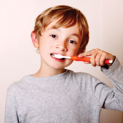 Photo of child brushing teeth