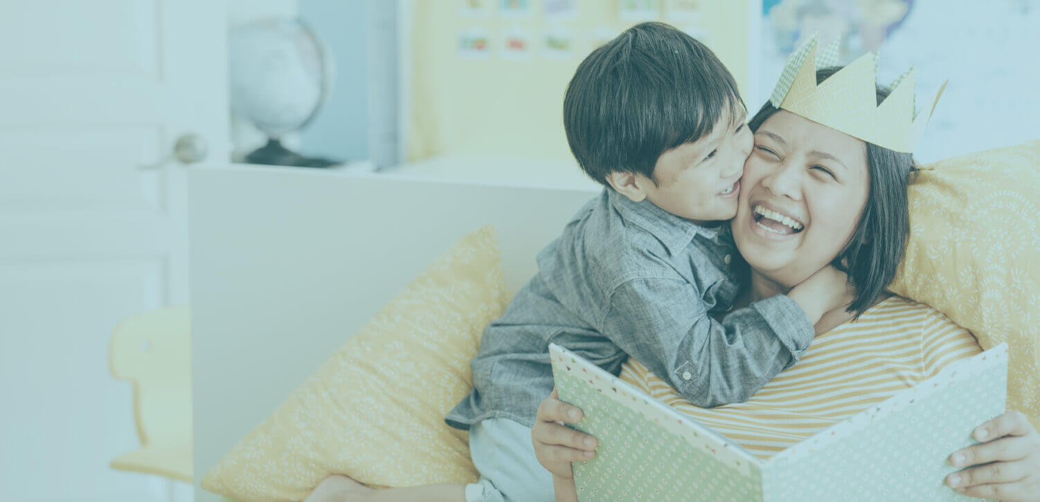 Boy hugging mom