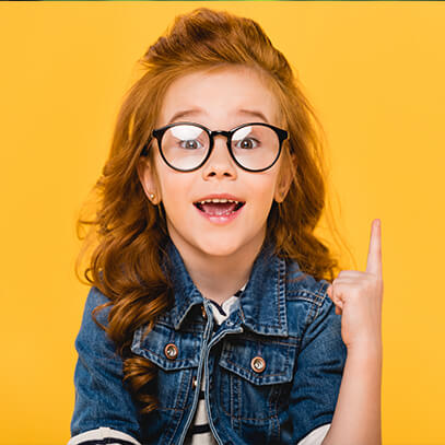 Young girl with glasses pointing up