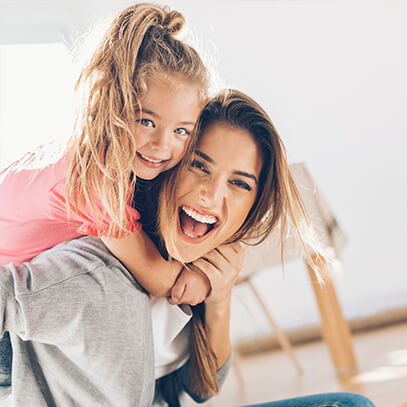 mother and daughter laughing