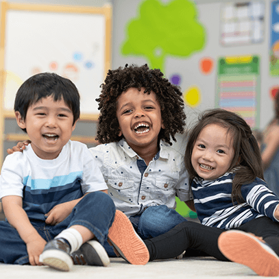 three children in a classroom