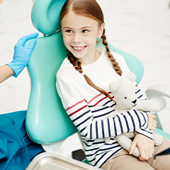 young girl at the dentist