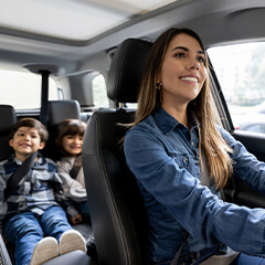 mother driving her two children around