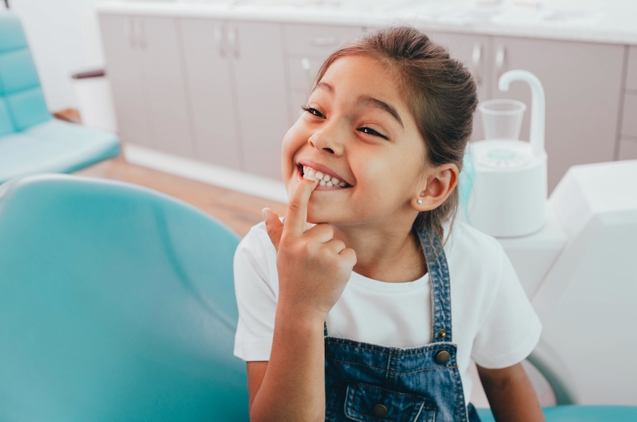 young girl at preventive dentistry appointment at the dentist to prevent cavities